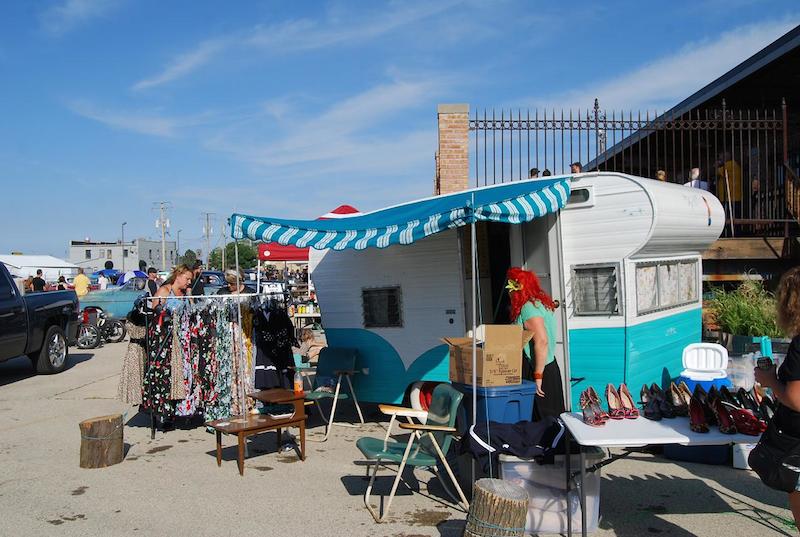 This vendor was selling vintage clothing and accessories from an old-fashioned, turquoise-and-white travel trailer.