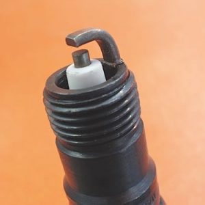 Photo 1: A conventional spark plug should never be used in a long-life application because its electrodes quickly erode. Also, its mild steel shell can allow the spark plug to seize in an aluminum cylinder head.
